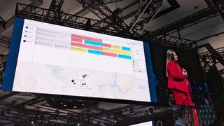 A map showing available field technicians on a screen at the keynote stage at SuiteWorld 2023.