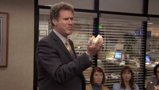 DeAngelo holding a handful of cake in The Office