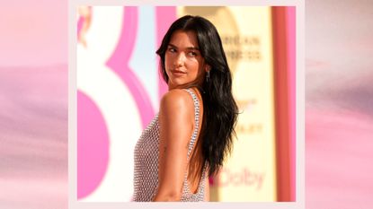 Dua Lipa wears a silver, sheer dress at the premiere of "Barbie" held at Shrine Auditorium and Expo Hall on July 9, 2023 in Los Angeles, California/ in a pink sunset-like gradient template