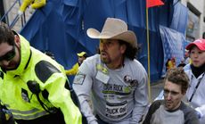 Carlos Arredondo, along with medical responders helped get severely injured man away from the blasts.