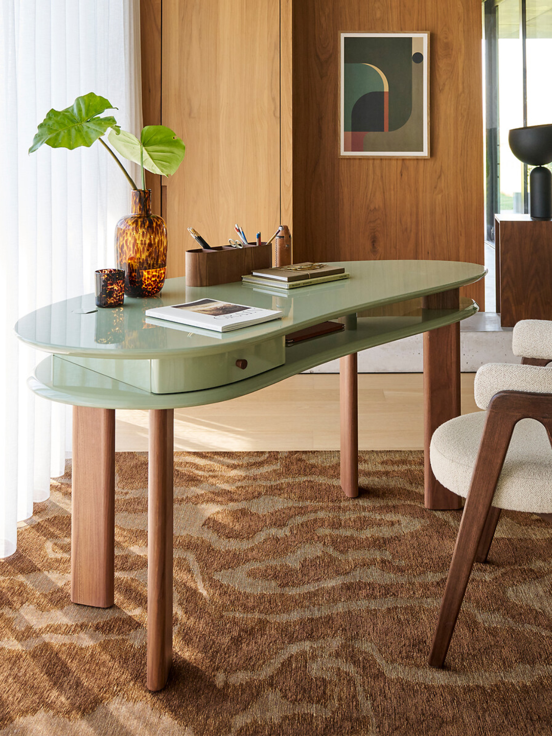 A green two-top bean-shaped desk from La Redoute