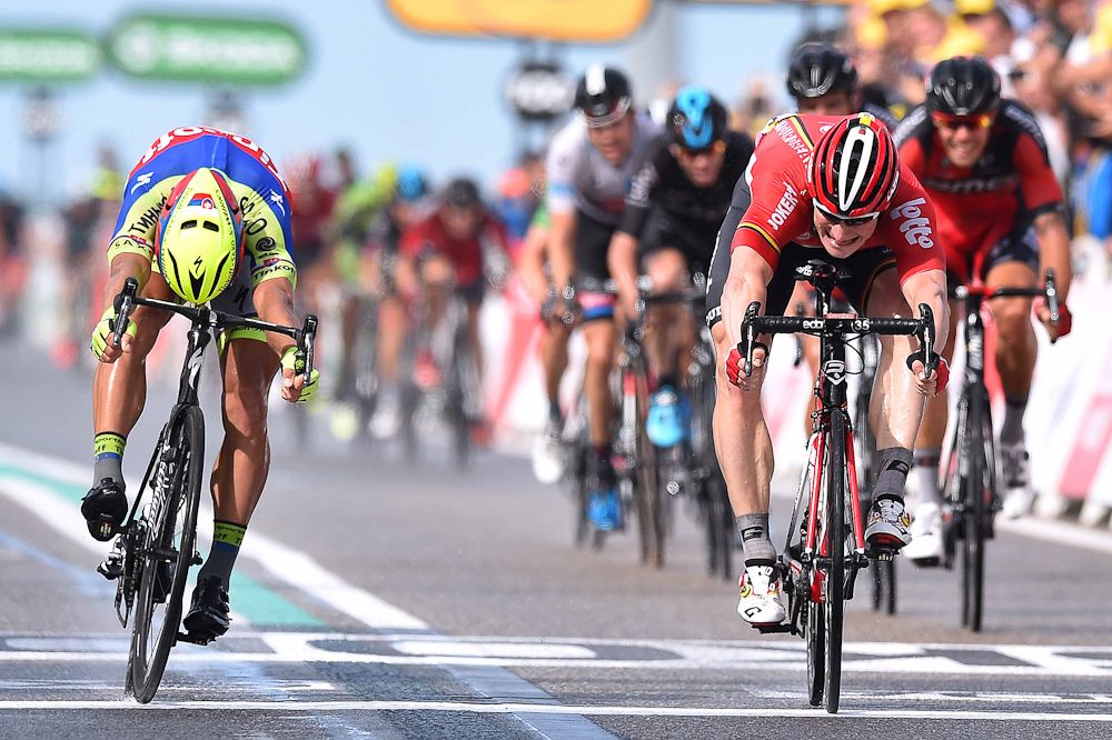 Andre Greipel wins stage 2 of the 2015 Tour de France by a bike throw over Peter Sagan.