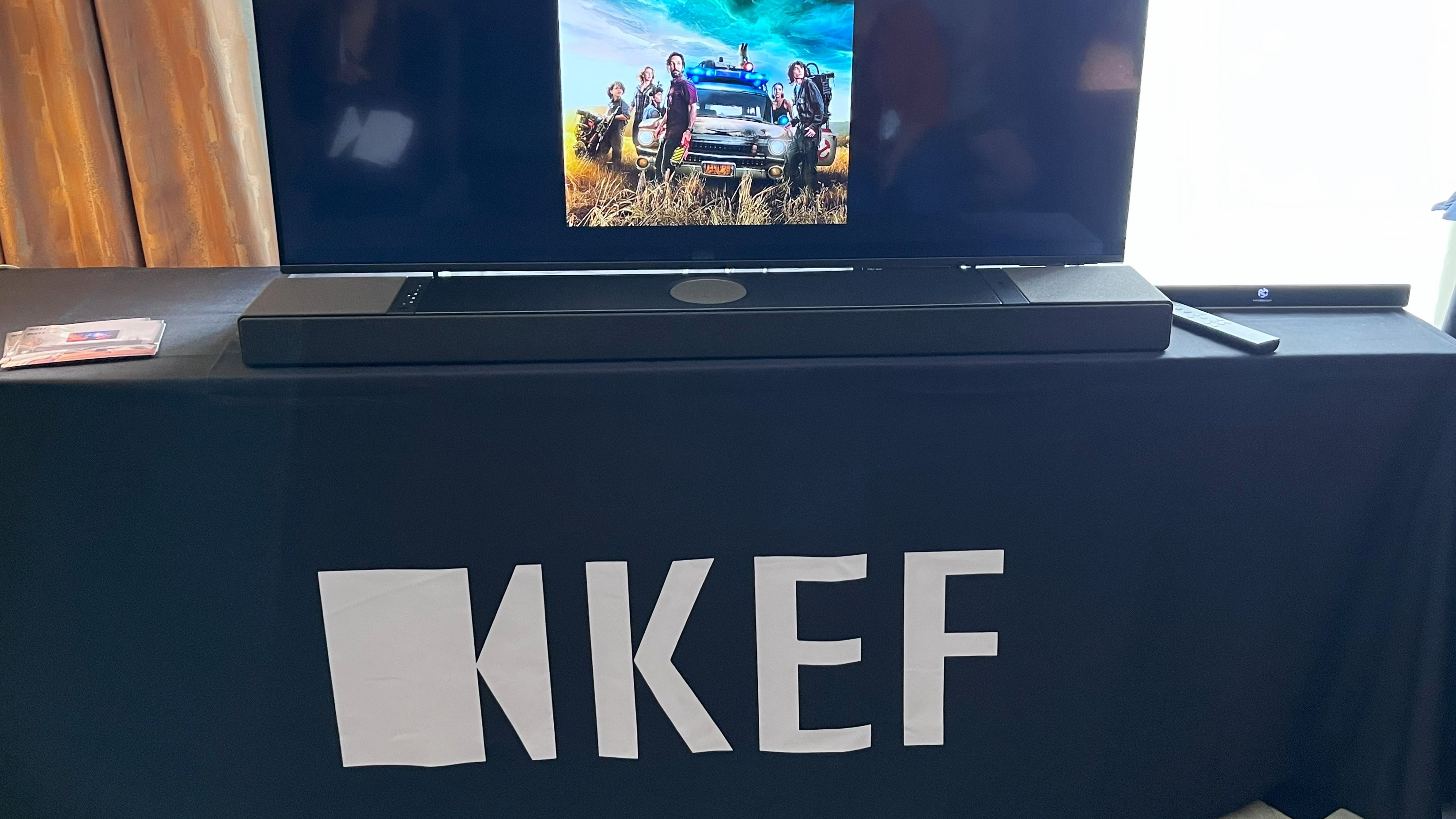 KEF XIO soundbar in black on table