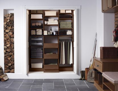 a linen closet with folded sheets