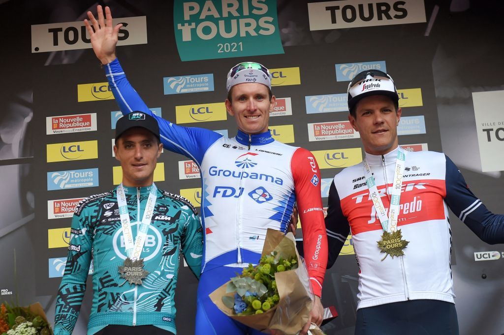 French rider of team Groupama FDJ Arnaud Demare C celebrates on the podium next to 2nd placed French rider of team BB Hotels PB KTM Franck Bonnamour R and 3rd placed Belgian rider of team Trek Segafredo Jasper Stuyven L after the 115th edition of the 2123 km ParisTours one day cycling race in Tours Central France on October 10 2021 Photo by GUILLAUME SOUVANT AFP Photo by GUILLAUME SOUVANTAFP via Getty Images
