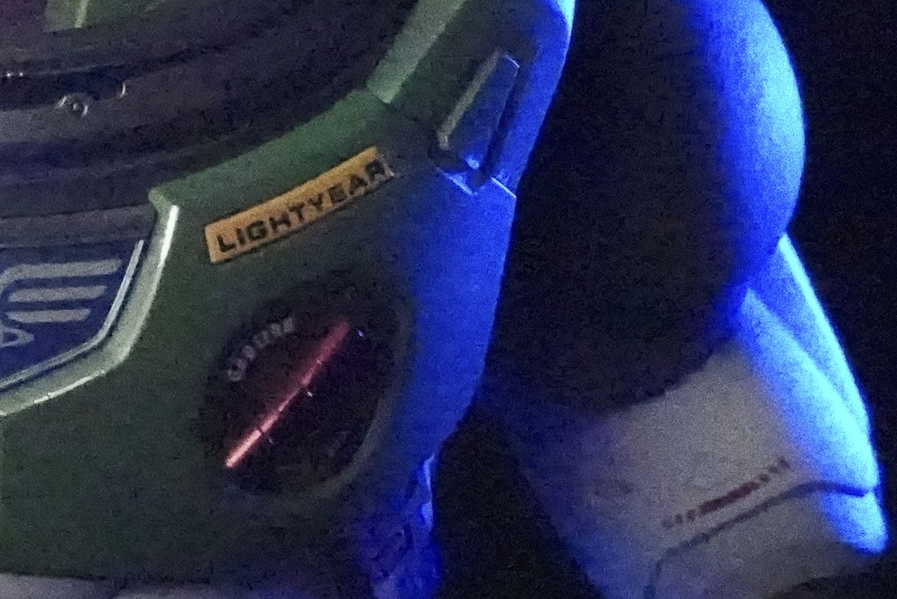 Sony ZV-E10 II sample images of buzz lightyear toy in dark studio taken at different ISO settings