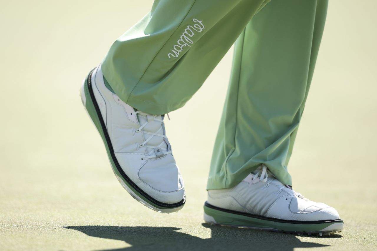 A detailed view of the shoes worn by Jason Day of Australia on the 18th green during the first round of the 2026 Masters Tournament at Augusta National Golf Club