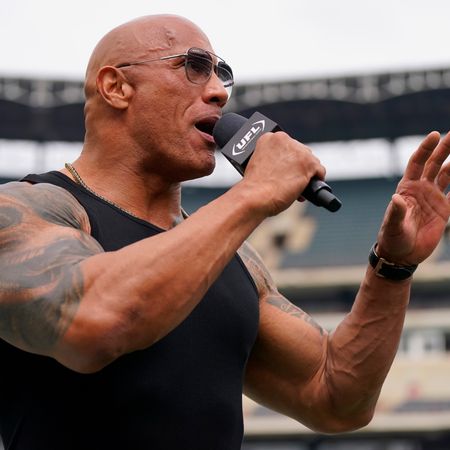 The Rock reacts prior to a game between the Birmingham Stallions and Arlington Renegades at Choctaw Stadium on March 30, 2024 in Arlington, Texas.
