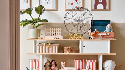 Open shelving unit in a kids room with baskets to keep it organised