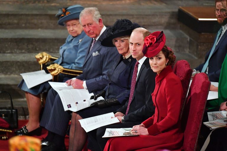 Queen Elizabeth II, Prince Charles, Camilla, the Duchess of Cornwall, Prince William and Kate, teh Duchess of Cambridge are sat in a row of seats at the Commonwealth service in March 2020.