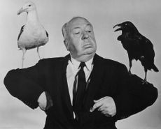 Alfredi Hitchcock in a promotional still for The Birds