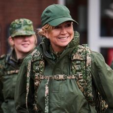 Queen Maxima wearing a military uniform and baseball cap