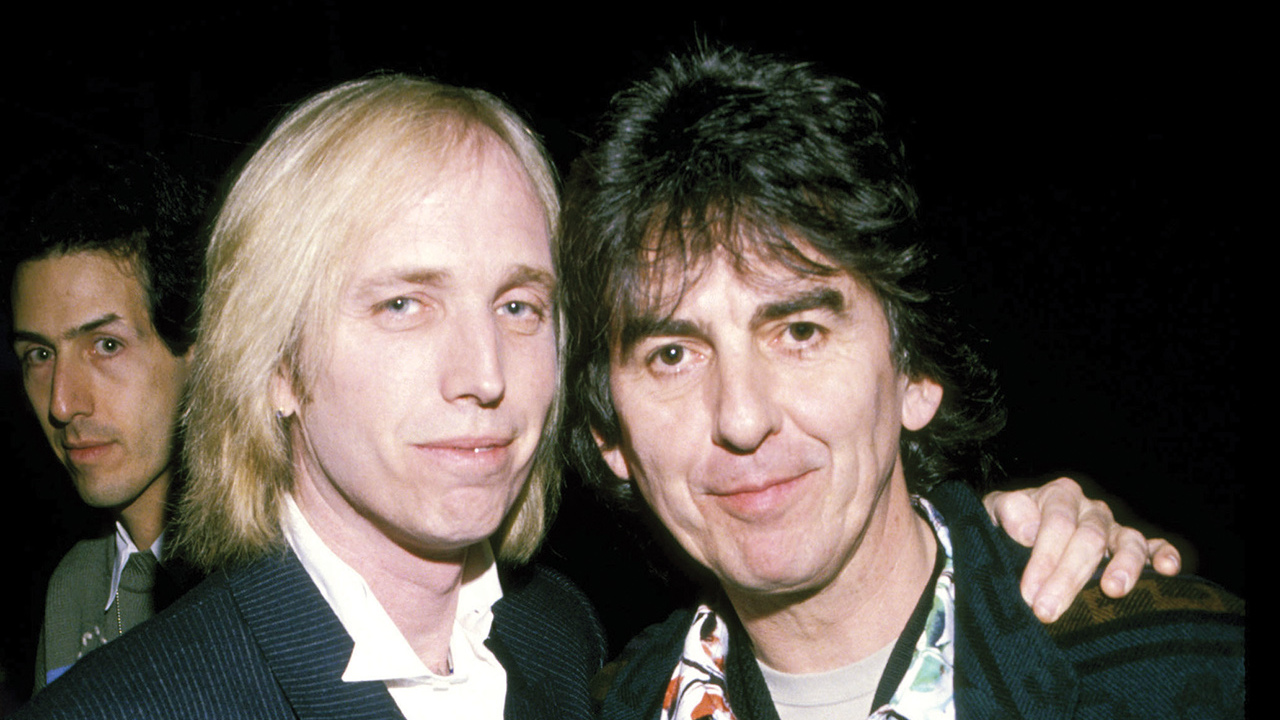 A photograph of George Harrison posing with Tom Petty