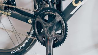 A Campagnolo Super-Record crankset on a black road bike