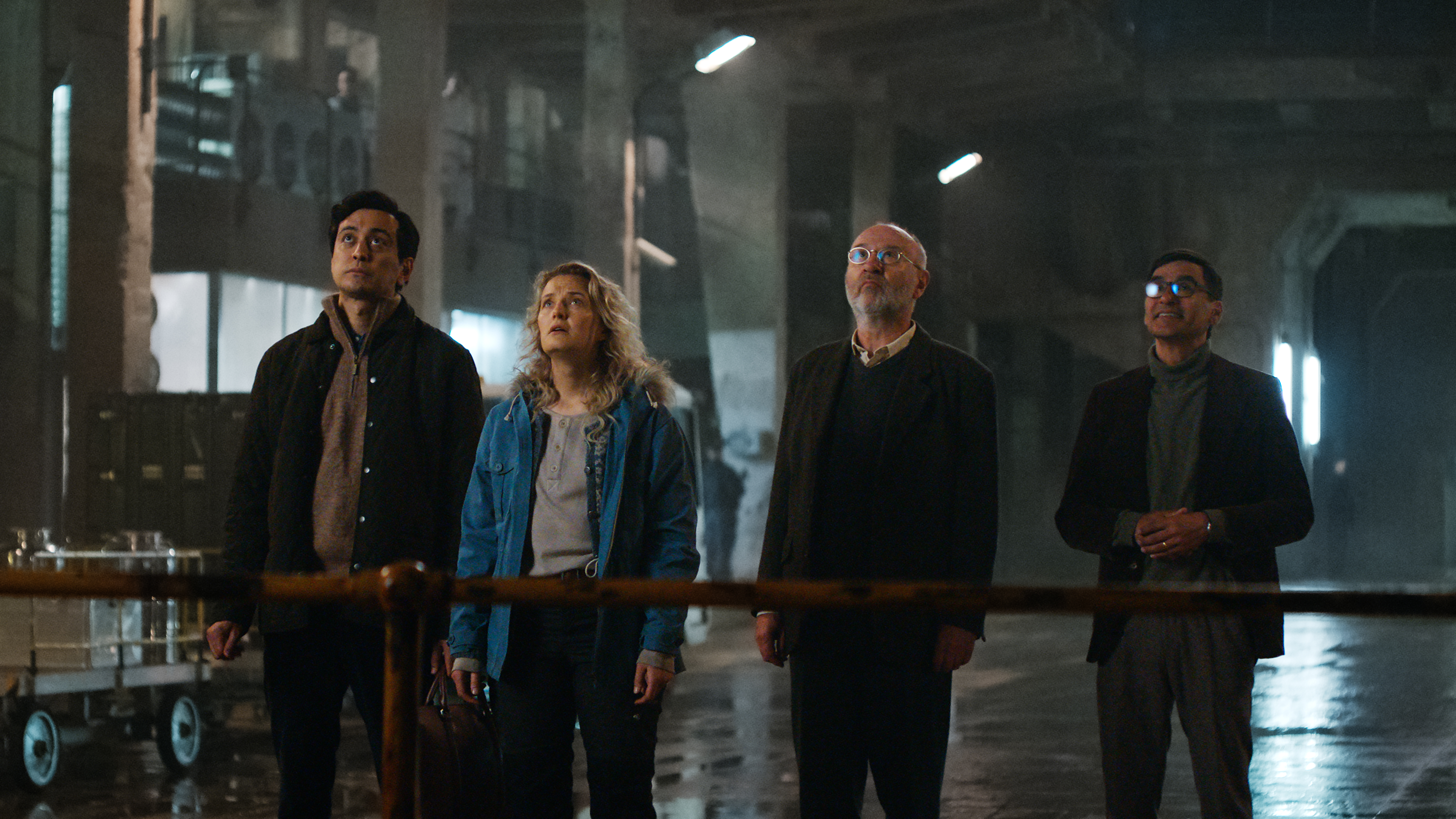 (L-R) Kim Falck as Andreas Isaksen, Ine Marie Wilmann as Nora Tidemann, Jon Ketil Johnsen as Professor Møller and Duc Mai-The as Professor Wangel in "Troll 2" on Netflix
