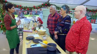 One of the contestants and the judges/hosts in the Great British Baking Show: Holidays.