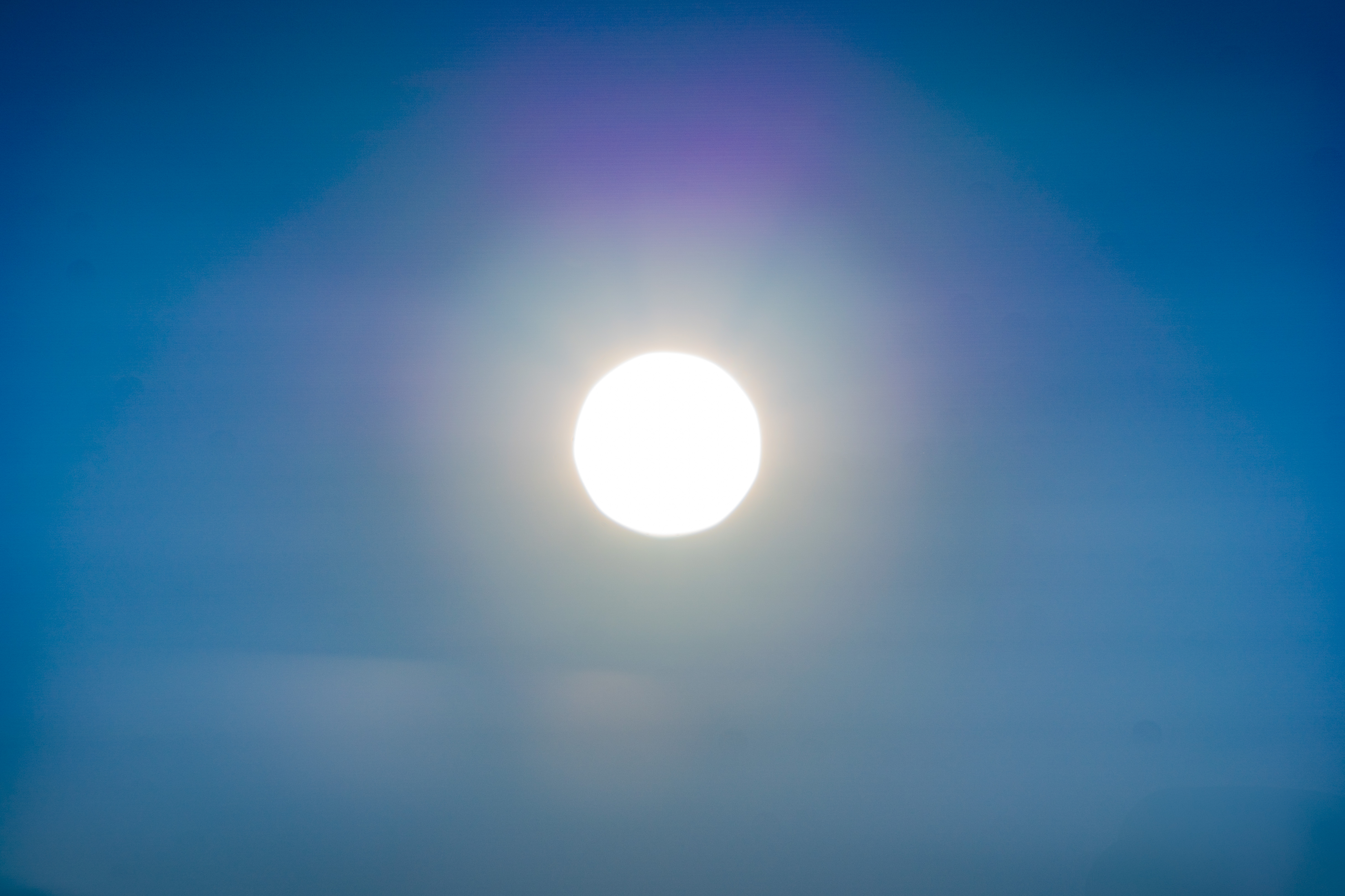 A bright sphere on a blue background