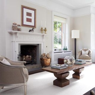 living room with photoframe on white wall and fireplace