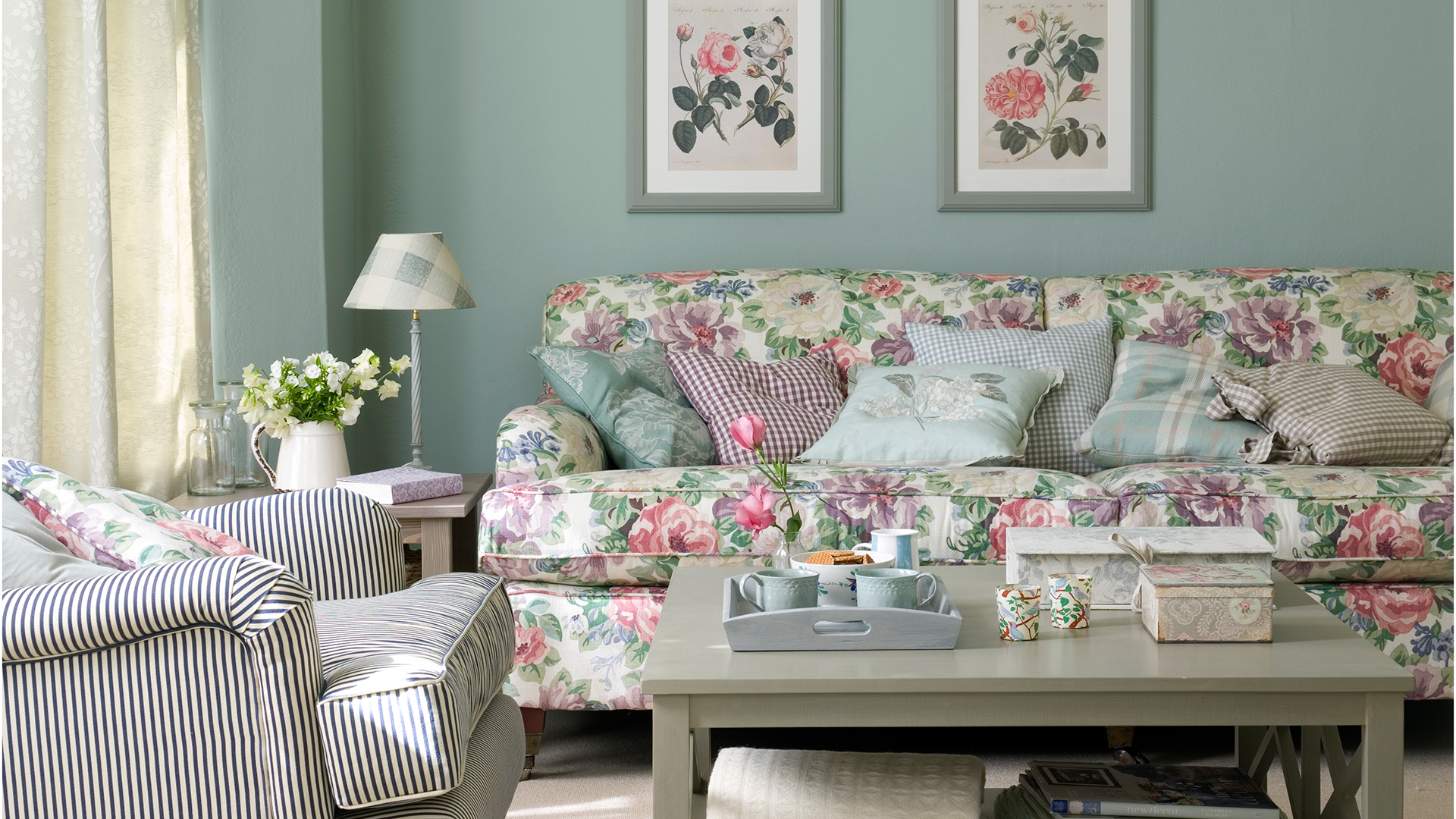 sage green living room with floral print sofa
