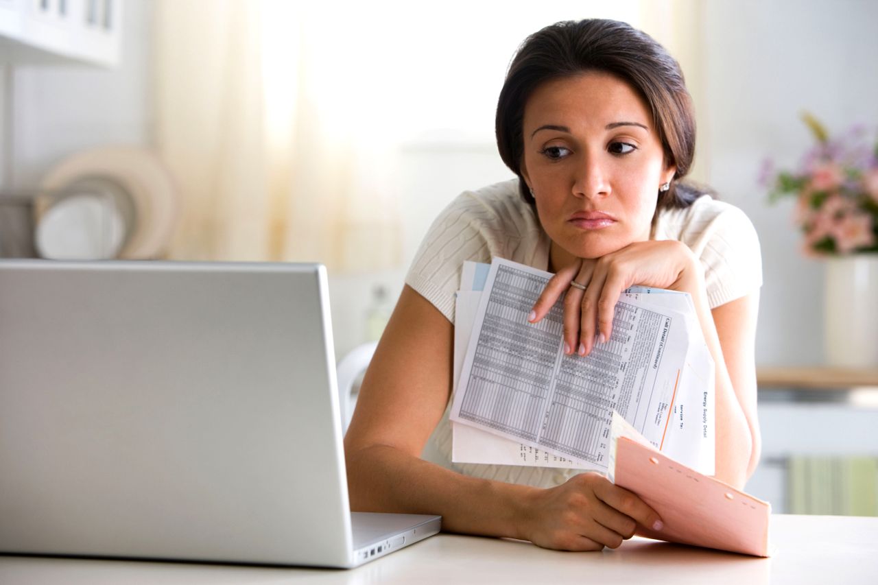 A woman paying bills.