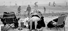 Porth Oer (Whistling Sands) - Enjoying the beach. 2004 ©David Hurn / Magnum Photos, and taken from the exhibition ‘The Great British Seaside: Photography from 1960s to present’ at the National Maritime Museum