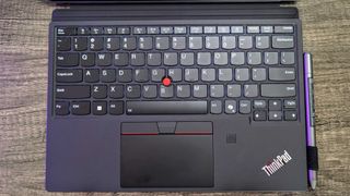 A close of up the Lenovo ThinkPad X12 Detachable (Gen 2)'s Folio Keyboard and Lenovo Precision Pen.