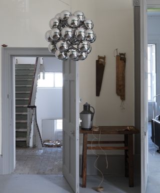 Shadow White hallway with chandelier