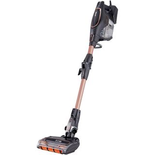 vacuum cleaner with corded stick and white background