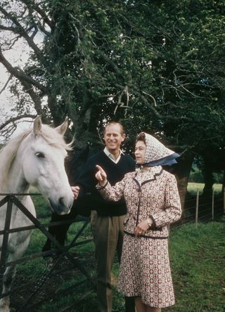 The Queen and Prince Philip with a horse