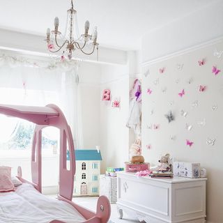 children room with butterfly wall and miniature home