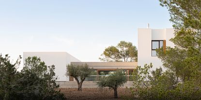 Formentera House by Mari&agrave; Castell&oacute;, a white concrete structure in the countryside