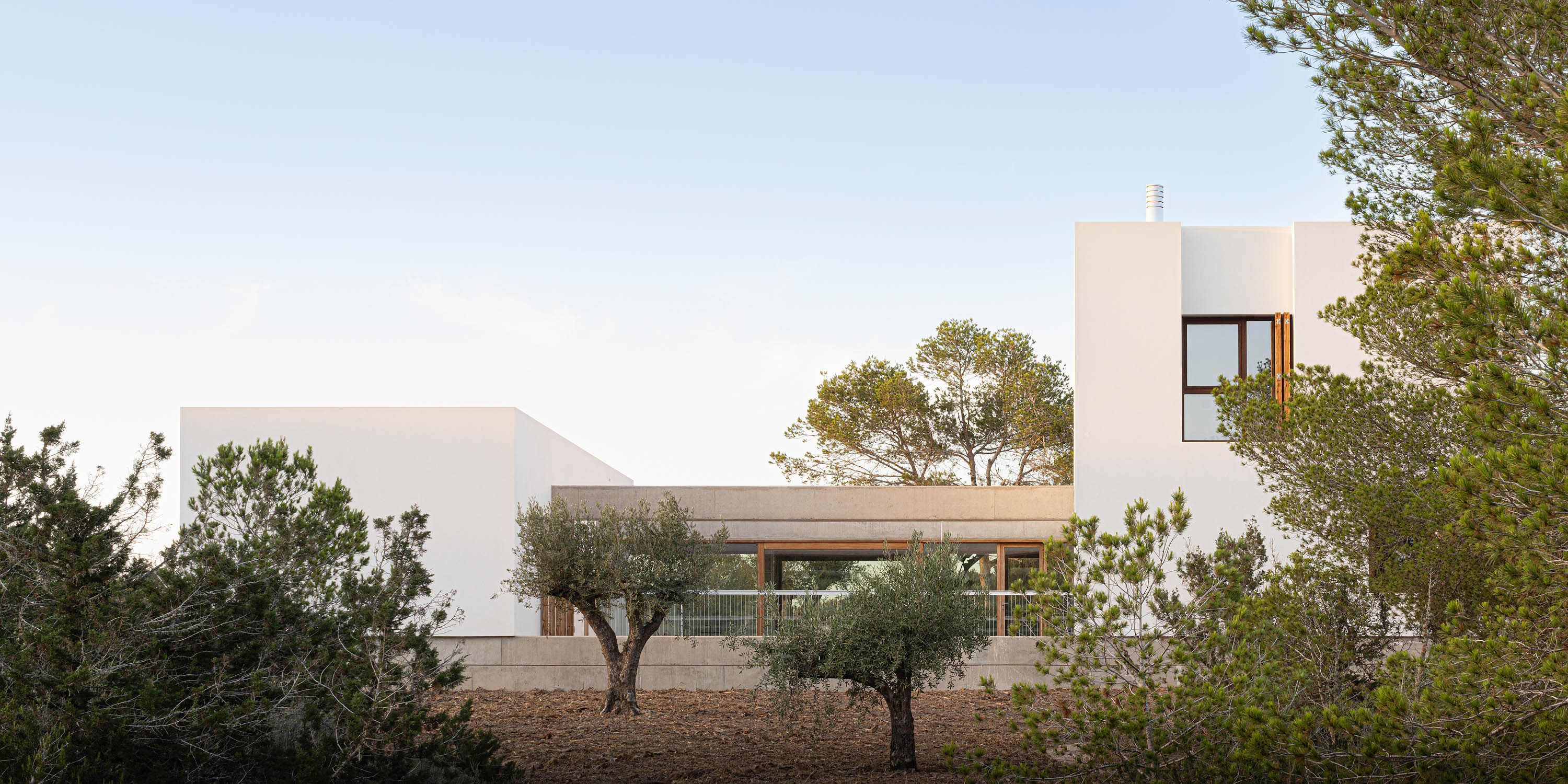 Formentera House by Mari&agrave; Castell&oacute;, a white concrete structure in the countryside