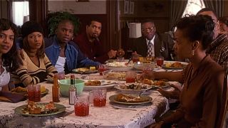 The cast of Soul Food sitting at the dinner table