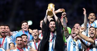 What was the cloak that Lionel Messi wore to lift the World Cup? Lionel Messi of Argentina lifts the FIFA World Cup Qatar 2022 Winner's Trophy during the FIFA World Cup Qatar 2022 Final match between Argentina and France at Lusail Stadium on December 18, 2022 in Lusail City, Qatar.