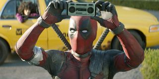 Deadpool holding up a small boombox Deadpool 2