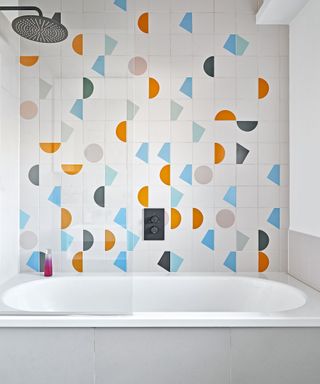 White bathroom with graphic pattern on white tile