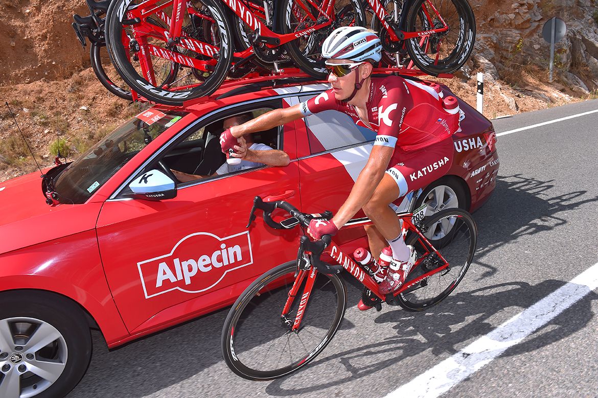 Matvey Mamykin back with the team car at the Vuelta a Espa&ntilde;a