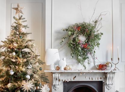 scandi garland and christmas tree in a white living room