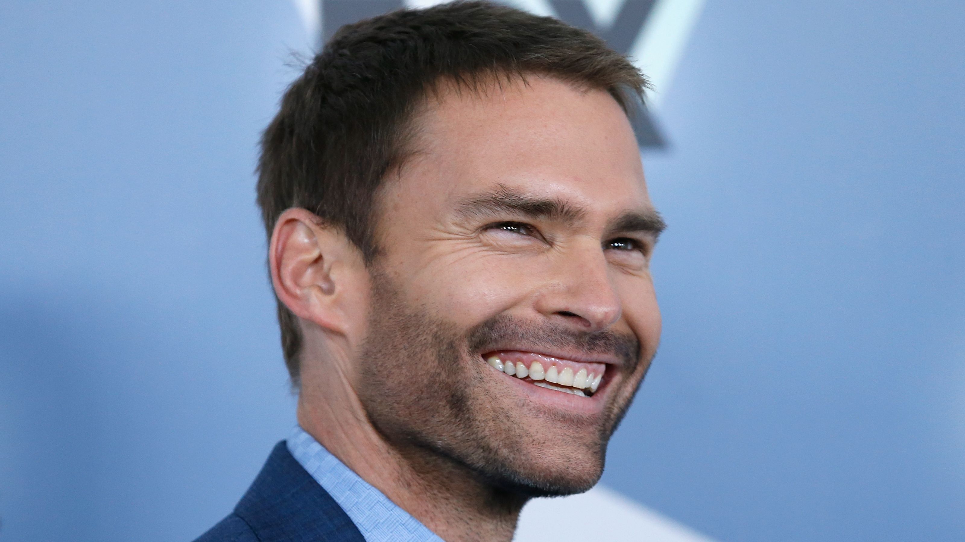 seann william scott on a blue background