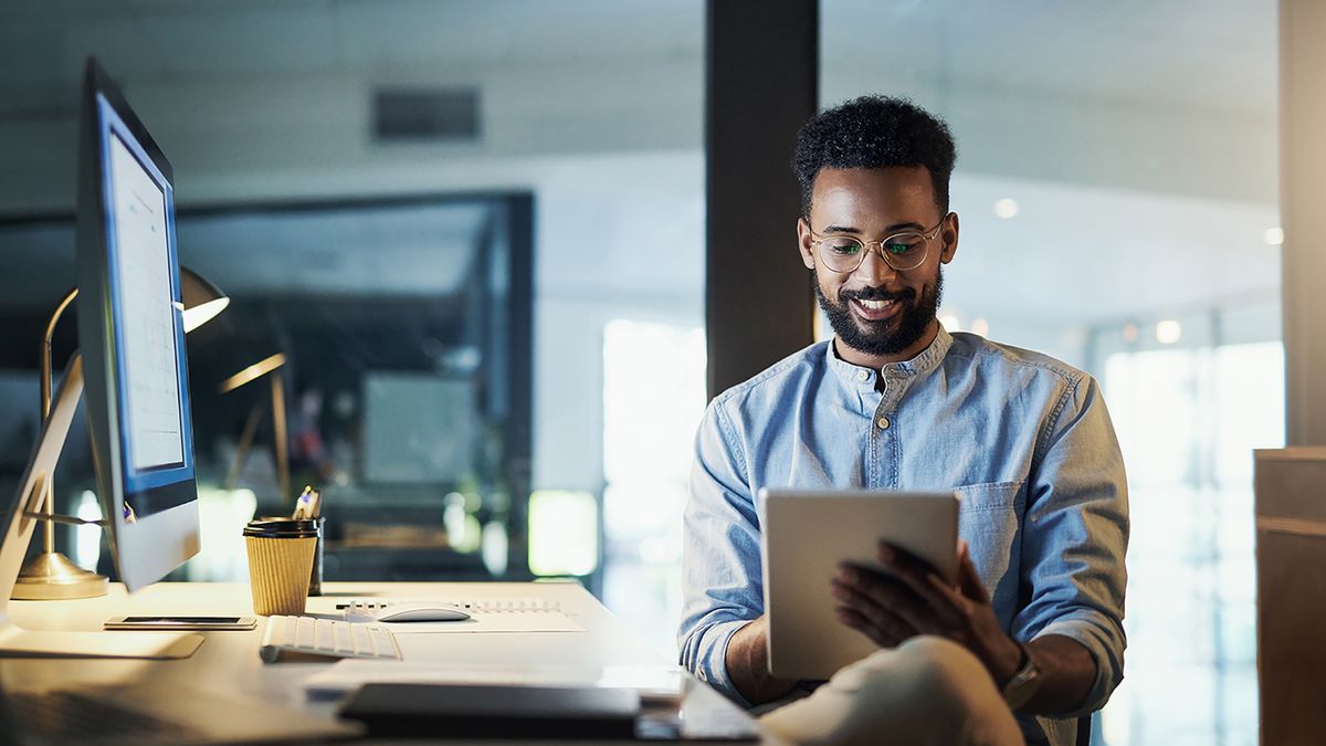 man using a tablet in an office