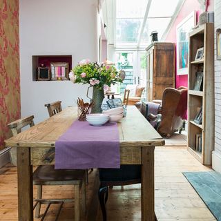 dining area with wooden flooring and wooden table