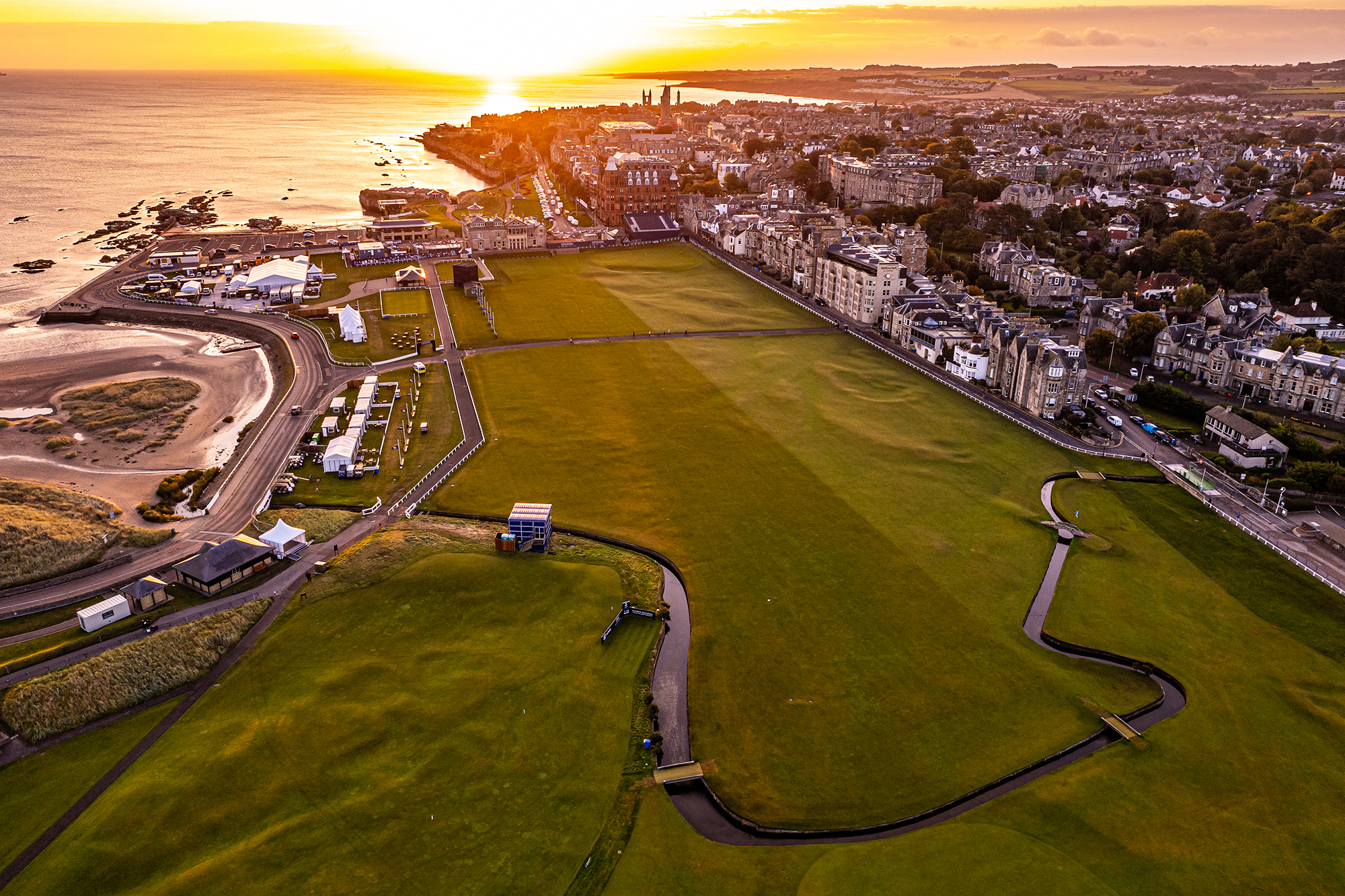 the 18th on the Old Course at St. Andrews, drenched in low sunlight at sunset