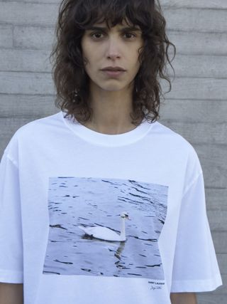 woman wears Saint Laurent Juergen Teller T-shirt with photograph of swan