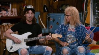 Wayne with guitar and Garth with drumsticks in Wayne's World 2