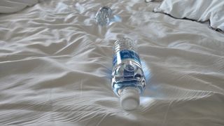 Westin Heavenly Bed with two water bottles on top to test motion isolation