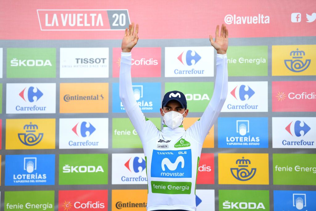 ALTODELANGLIRU SPAIN NOVEMBER 01 Podium Enric Mas Nicolau of Spain and Movistar Team White Best Young Jersey Celebration Mask Covid safety measures during the 75th Tour of Spain 2020 Stage 12 a 1094km stage from Pola de Laviana to Alto de lAngliru 1560m lavuelta LaVuelta20 La Vuelta on November 01 2020 in Alto de lAngliru Spain Photo by Justin SetterfieldGetty Images