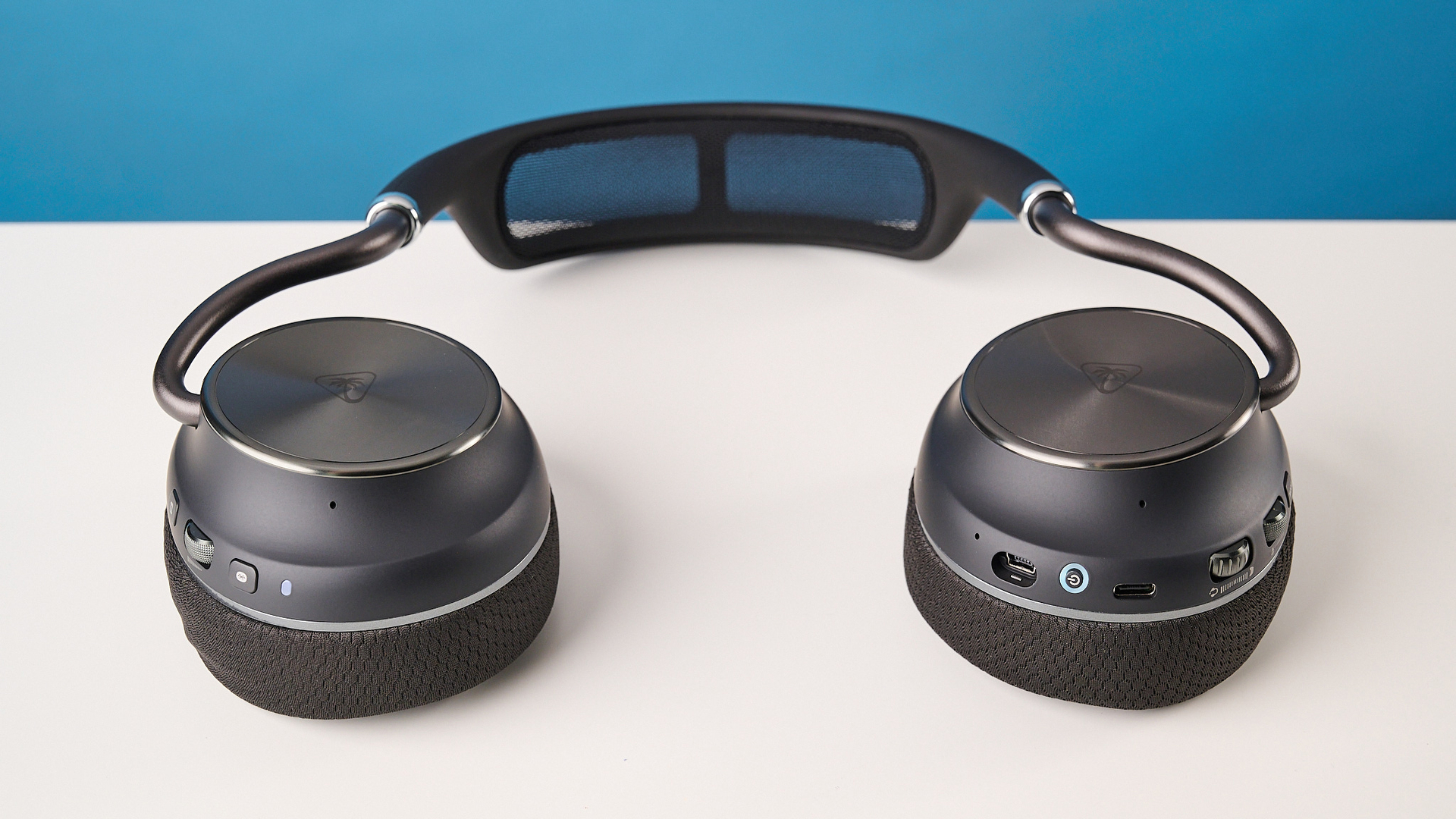The Turtle Beach Stealth Pro II laying flat on a white surface with a blue background