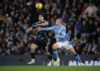 Leeds United defender Pascal Struijk battles with Manchester City star Erling Haaland