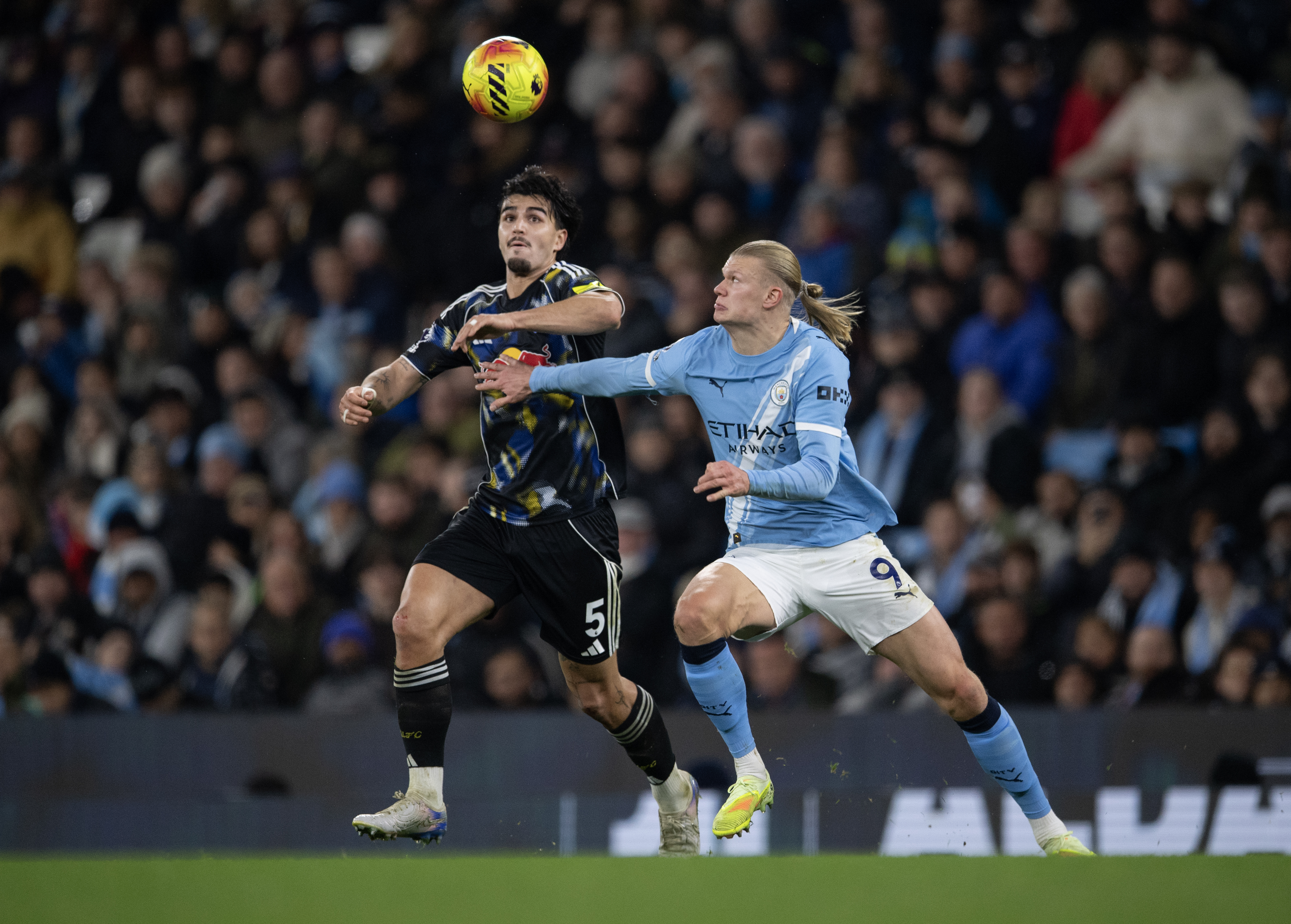 Leeds United defender Pascal Struijk battles with Manchester City star Erling Haaland