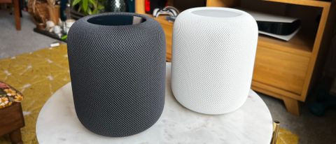 HomePod 2 in black and white on shelf in a home